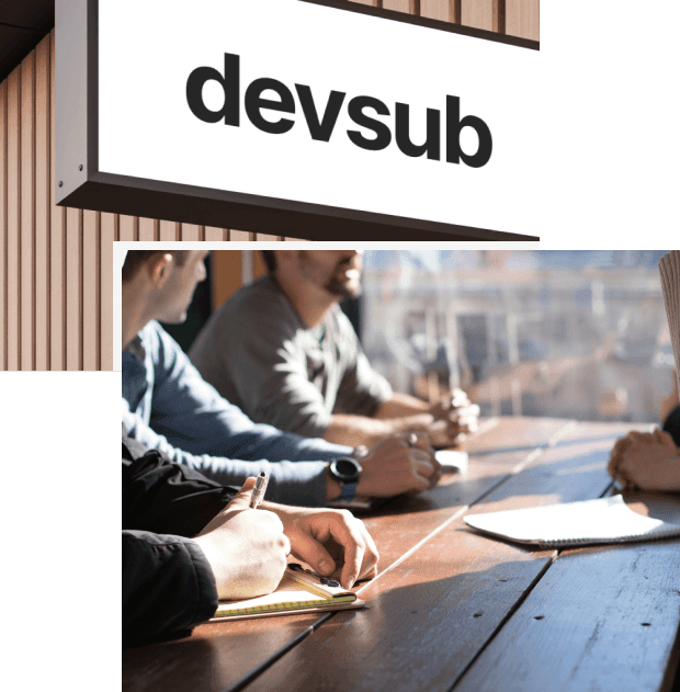 devsub logo and people who are working on a desk